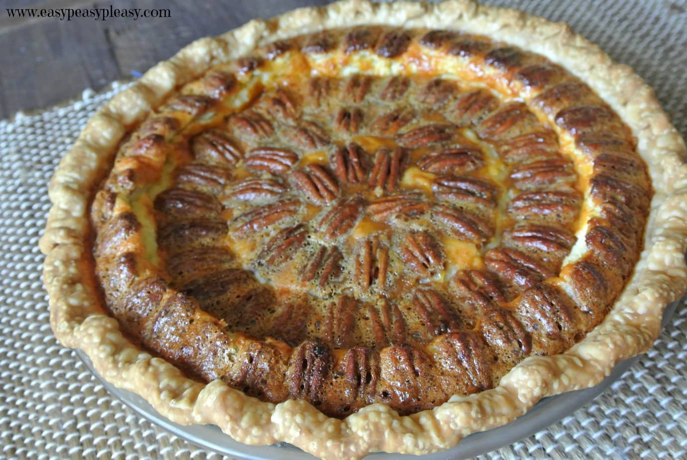 Caramel Pecan Cheesecake Pie is the best of both worlds!