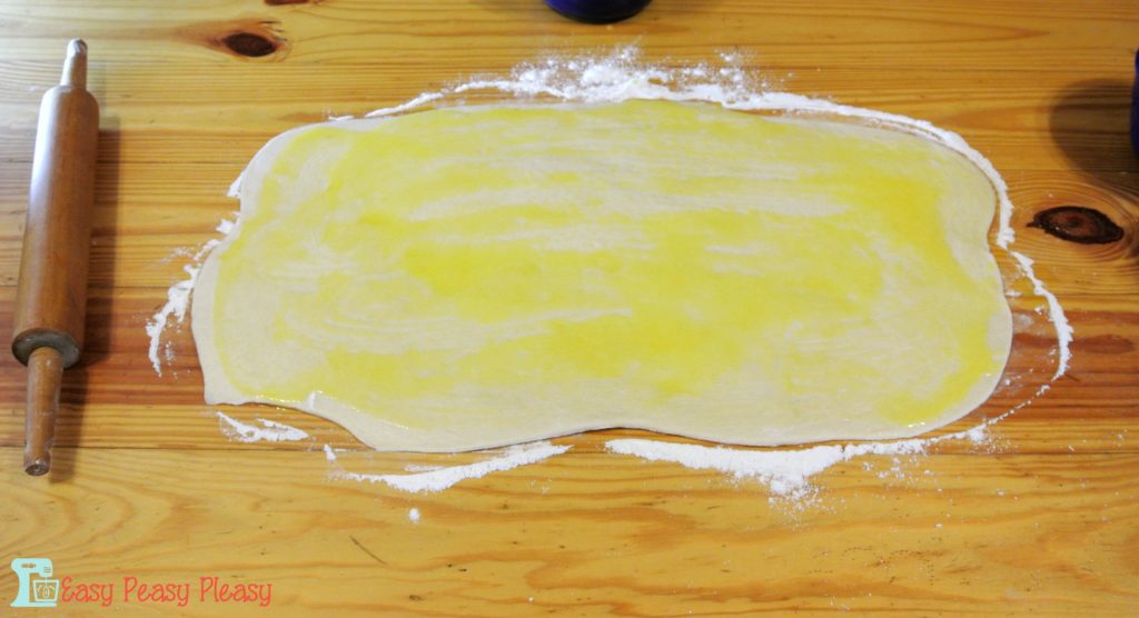 Butter the dough