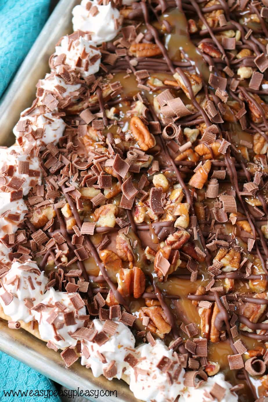 Feed a crowd with this easy but decadent Chocolate Turtle Slab Pie Recipe