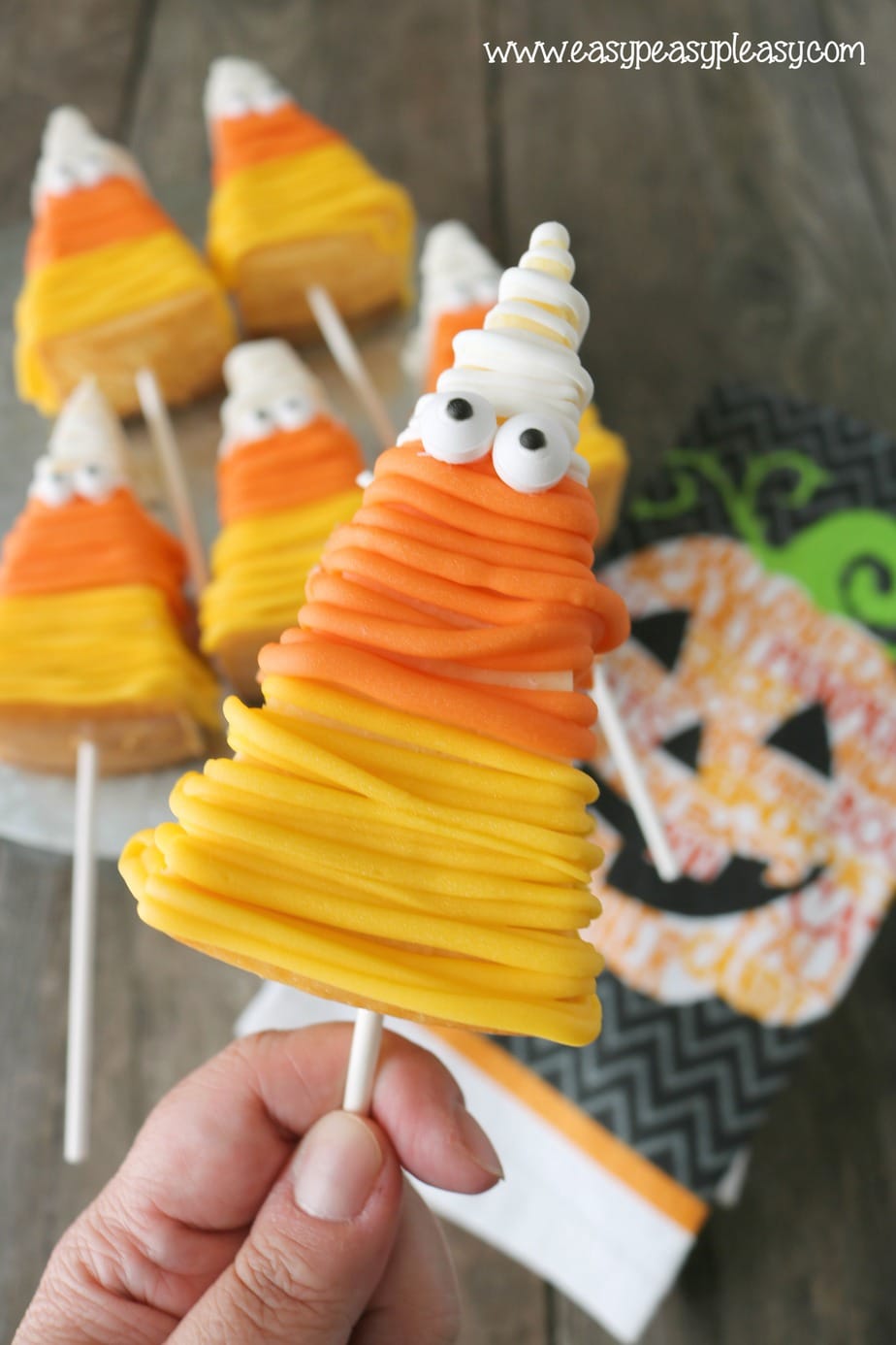 Get your Halloween Mummy on with these Candy Corn Cheesecake on a Stick. No Bake recipe at easypeasypleasy.com