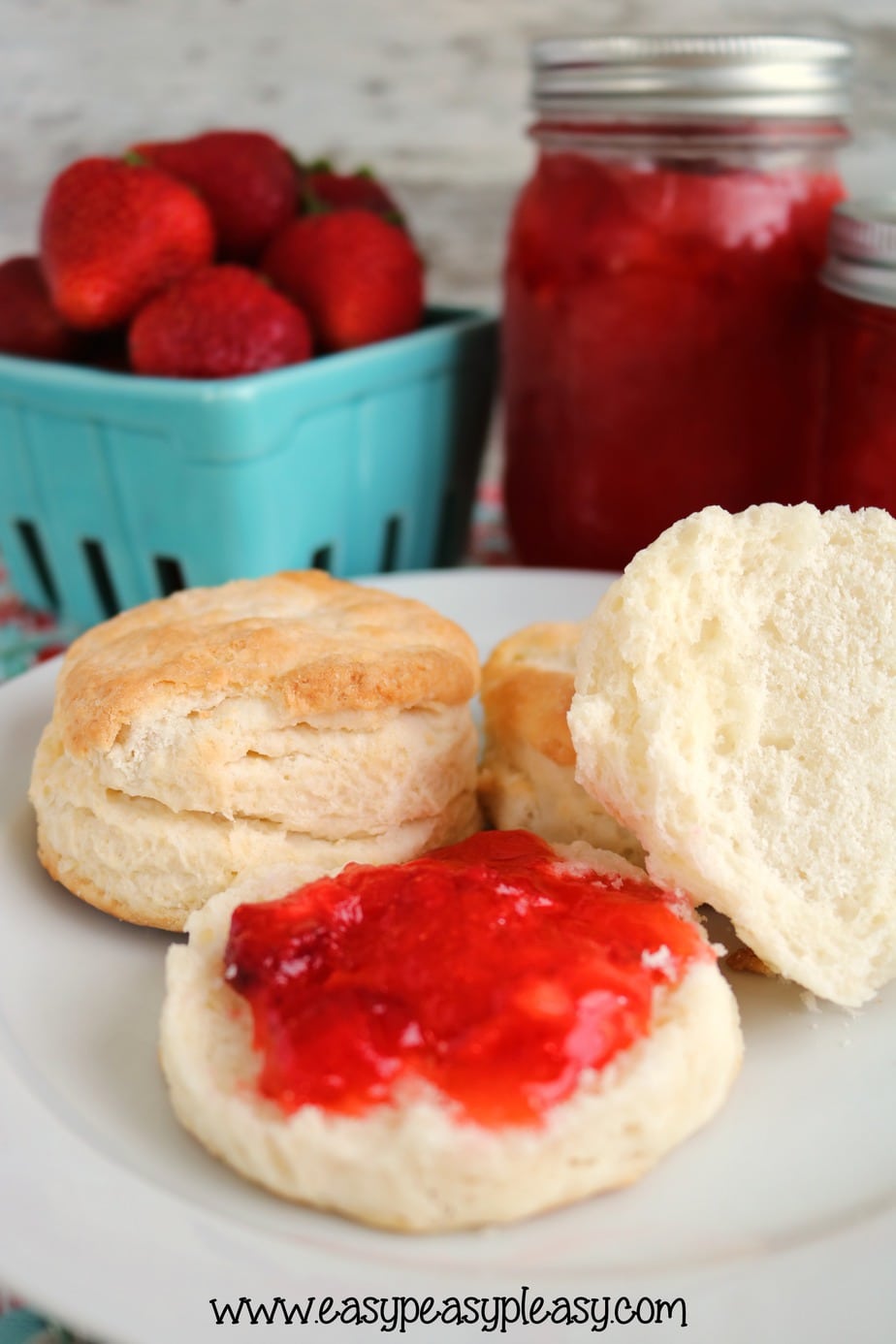 Check out this easy 3 Ingredient Strawberry Freezer Jam on top of these amazing homemade biscuits.