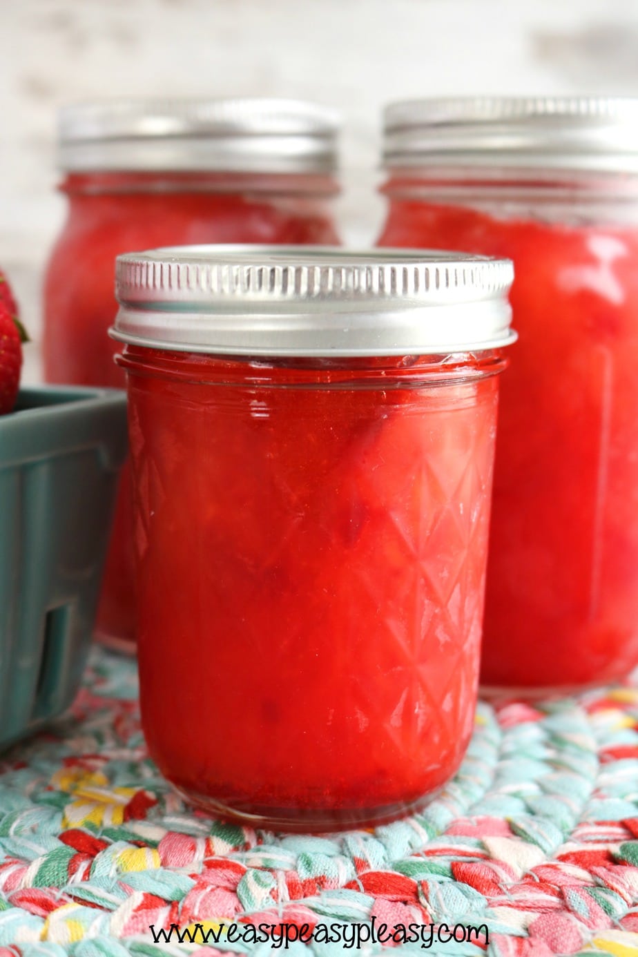 Grab a flat of strawberries and make a batch of super easy 3 ingredient Strawberry Freezer Jam. Plus check out some great ways to use that freezer jam.