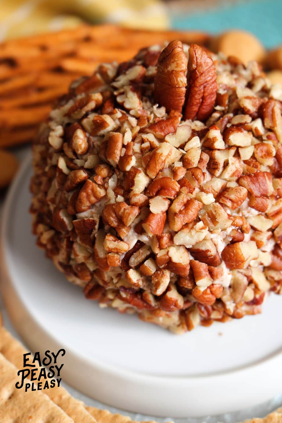 Pumpkin Spice Cheese Ball is the perfect appetizer for the Holidays. It's only 4 ingredients, freezer friendly, and perfect to make ahead.