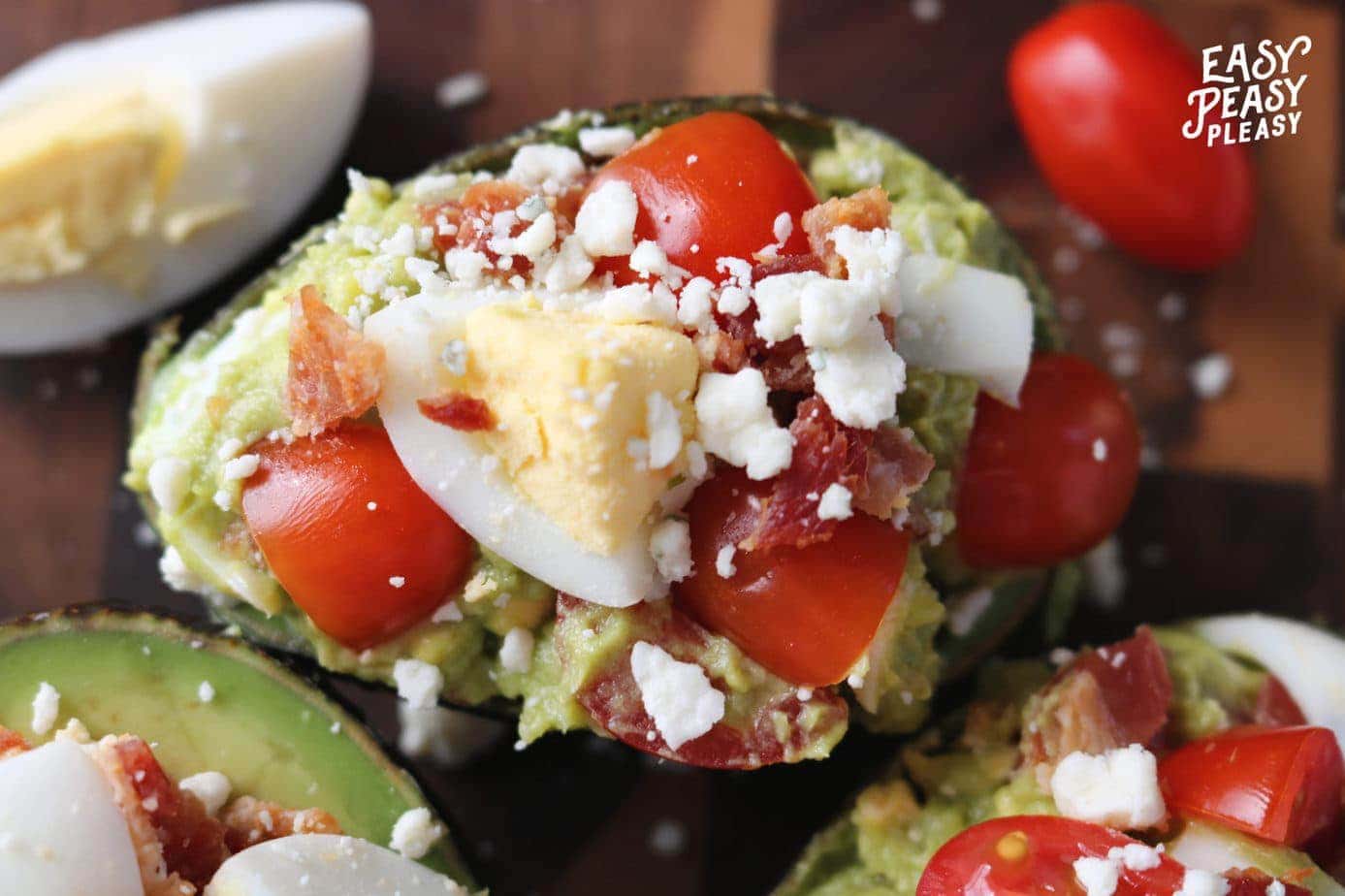 https://easypeasypleasy.com/wp-content/uploads/2020/04/Avocados-stuffed-with-Cobb-Salad-ingredients-is-the-perfect-recipe-to-use-up-hard-boiled-eggs.-scaled.jpg